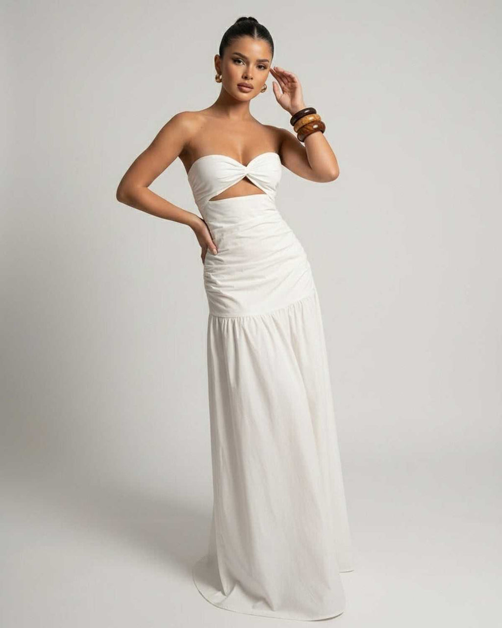 Serena Maxi Dress featuring a strapless design, cutout high waist, and flowing silhouette by Lauven.