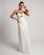 Serena Maxi Dress featuring a strapless design, cutout high waist, and flowing silhouette by Lauven.