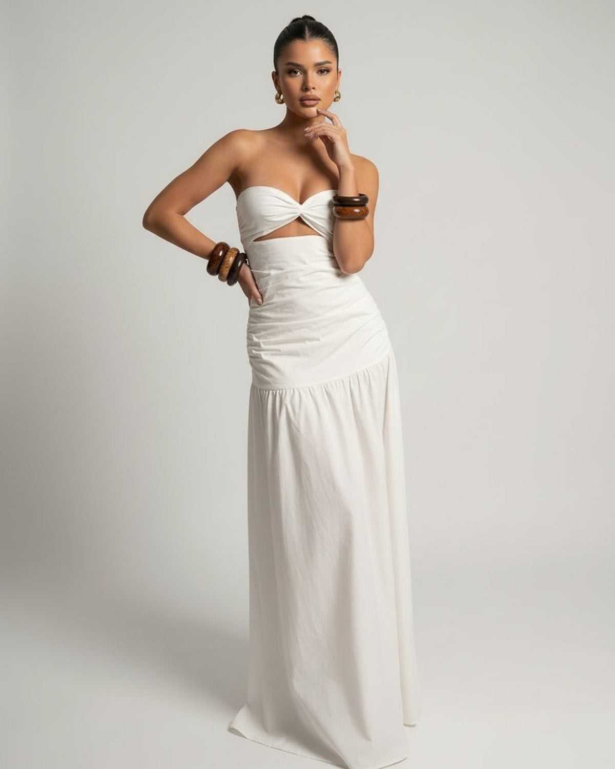 Serena Maxi Dress, white strapless design, cutout high waist silhouette by Lauven, elegant fit and flowing length.