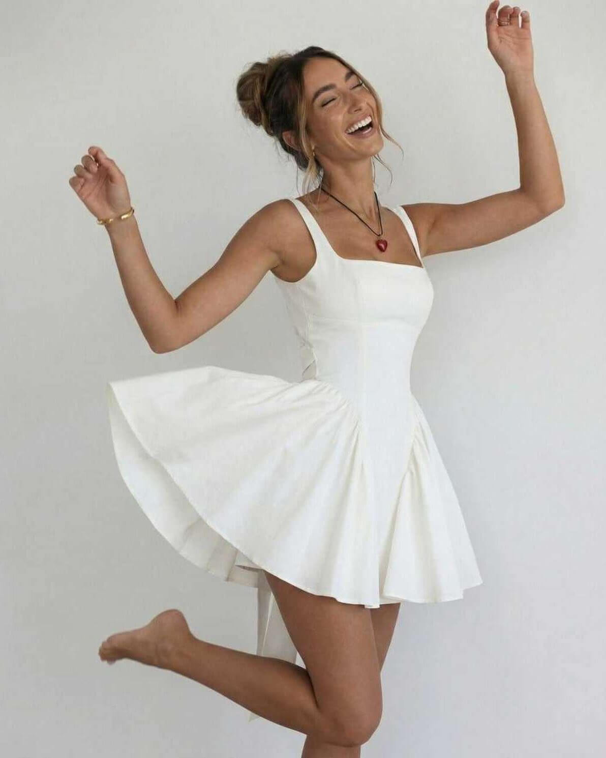 Serena Mini Dress by Lauven, elegant white square collar camisole dress with spaghetti straps and A-line profile.