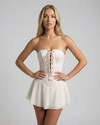Serena Mini Dress by Lauven - Strapless ivory corset mini dress with flared skirt and lace-up front detail.