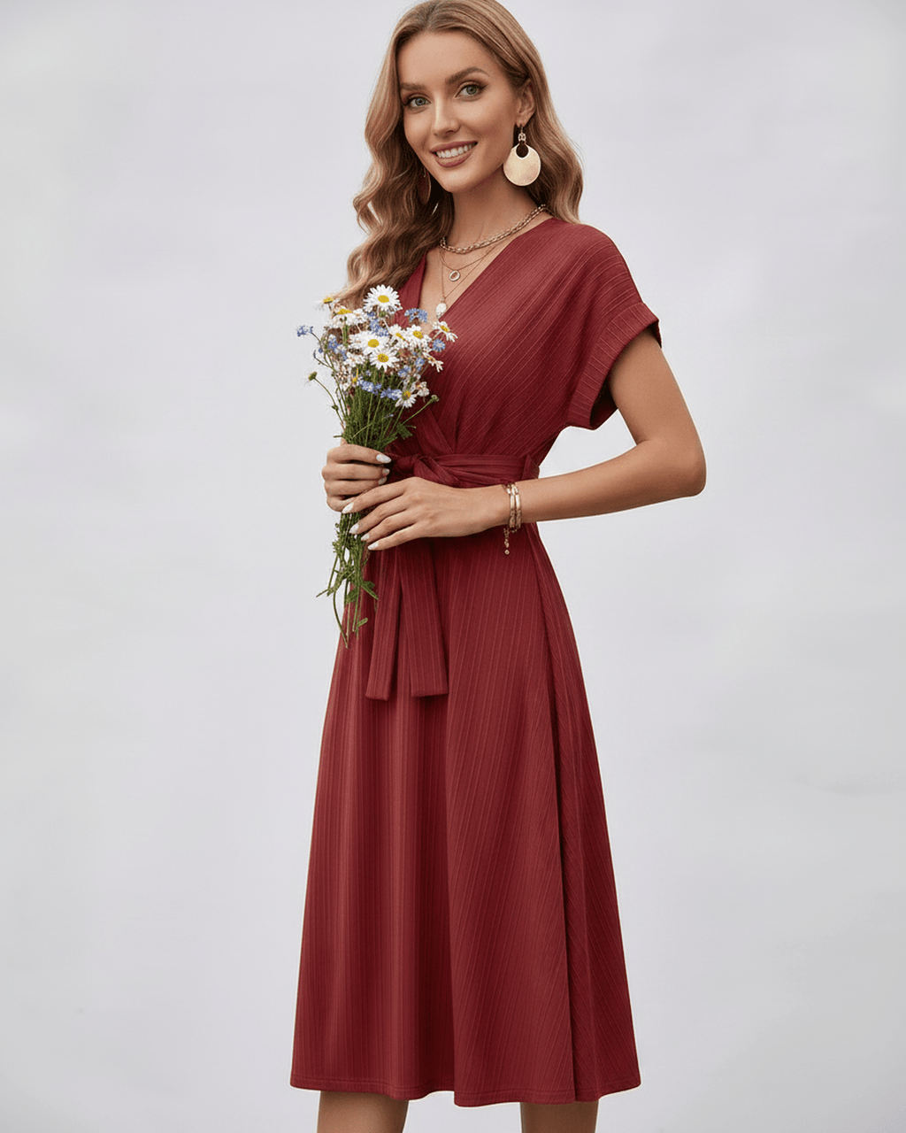 Serene Midi Dress in a warm rust shade, featuring a V-neck and pleated fabric, styled with a self-tie belt by Lauven.