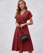 Serene Midi Dress in dark red with pleated fabric, V-neck, self-tie belt, from Lauven for versatile styling.
