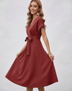 Serene Midi Dress featuring pleated fabric, V-neck design, and self-tie belt by Lauven.