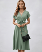 Serene Midi Dress by Lauven, featuring pleated fabric, V-neck, A-line silhouette, and adjustable self-tie belt for modern styling.