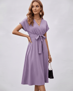 Serene Midi Dress in lavender pleated fabric with V-neck and self-tie belt from Lauven, perfect for versatile styling.