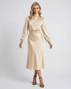 Lauven Sienna Midi Dress champagne satin high neck elegance with long sleeves, flattering silhouette.