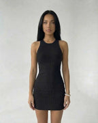 Sienna Mini Dress by Lauven, black ribbed knit sleeveless bodycon dress showcasing modern minimal style.