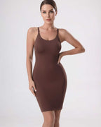 Lauven Sienna Mini Dress featuring ribbed knit, sleeveless design, sleek silhouette and stylish side slit.