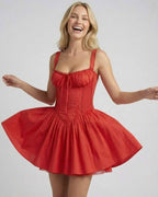 Sienna Mini Dress by Lauven, a red A-line mini dress with lace trim and playful flared skirt.