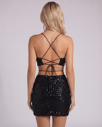 Sienna Mini Dress features a sequined silhouette with a halter neck and stylish back tie. Perfect sequin mini dress by Lauven.