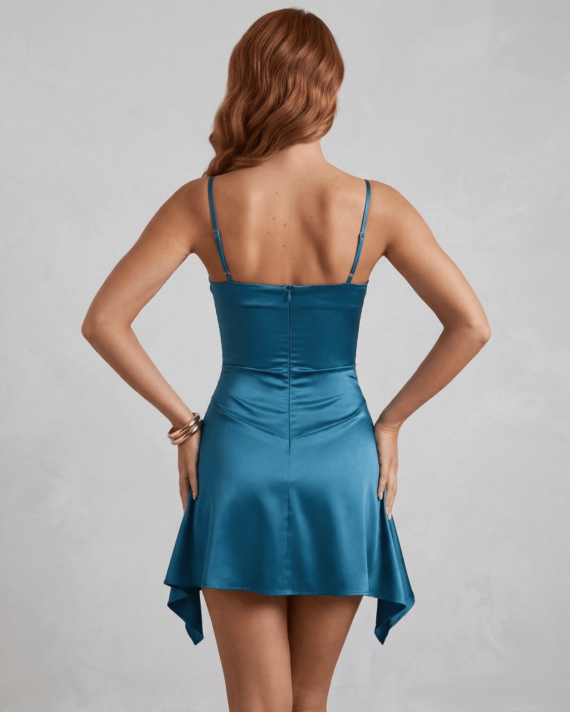 Back view of the Sienna Mini Dress featuring teal satin fabric and draped skirt by Lauven.
