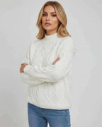 Sienna Sweater by Lauven – Women’s oversized cable knit sweater in white for stylish fall winter outfits.