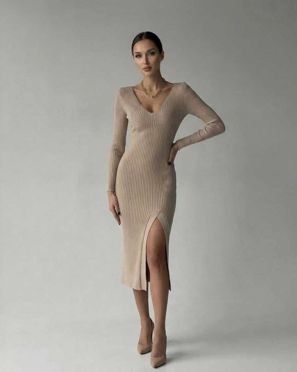 Sierra Midi Dress by Lauven, a sleek ribbed knit pencil dress with V-neck and thigh-high slit.