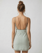 Sierra Mini Dress by Lauven showcasing an olive-trimmed back cut-out detail in pastel green.