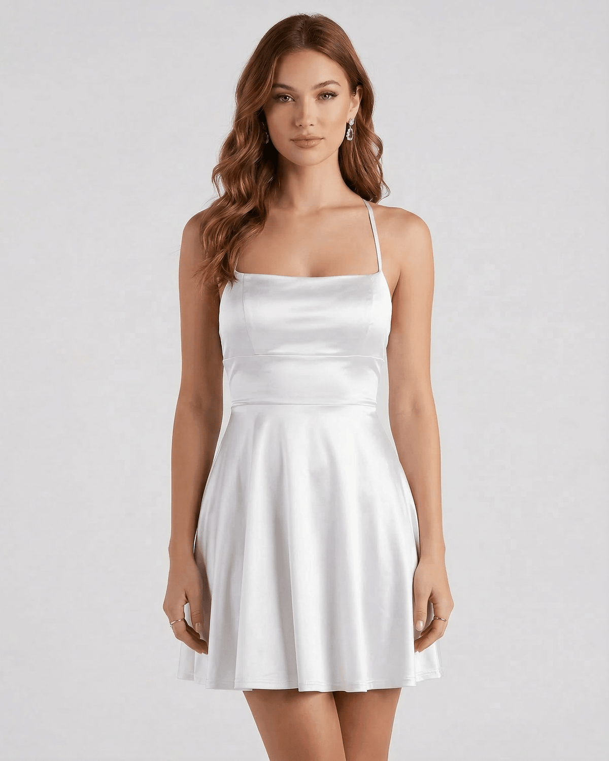 Silver Satin Mini dress by Lauven features a smooth satin finish, A-line silhouette, and delicate spaghetti straps.