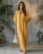 Solara Maxi Dress in yellow chiffon, featuring a V-neck, relaxed silhouette, perfect for warm weather by Lauven.