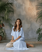 Model wearing the Solara Maxi Dress in light blue, showcasing its relaxed silhouette and lightweight chiffon fabric.