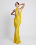 Solara Maxi Dress featuring a yellow halter design with deep plunge and high waist, by Lauven, perfect for special occasions.