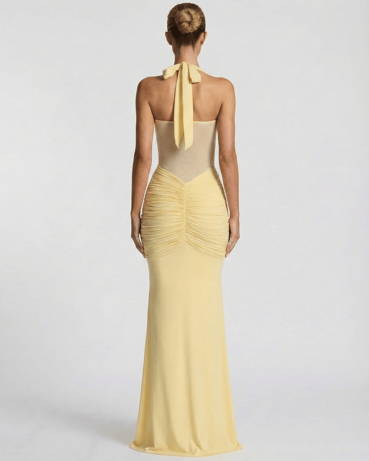 Solara Maxi Dress - elegant yellow halter dress with mesh panel and mermaid silhouette by Lauven.