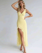 Solara Maxi Dress in yellow with ruffle slit, flowing silhouette, and elegant design by Lauven.