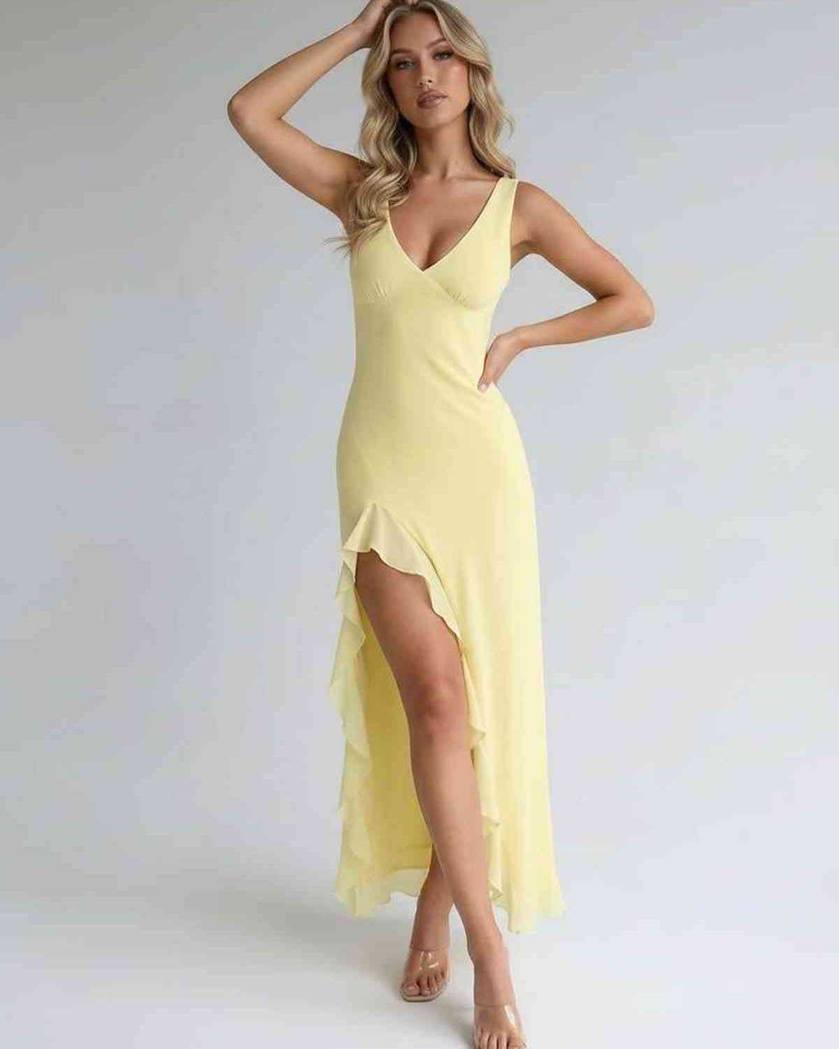 Solara Maxi Dress in yellow with ruffle slit, flowing silhouette, and elegant design by Lauven.
