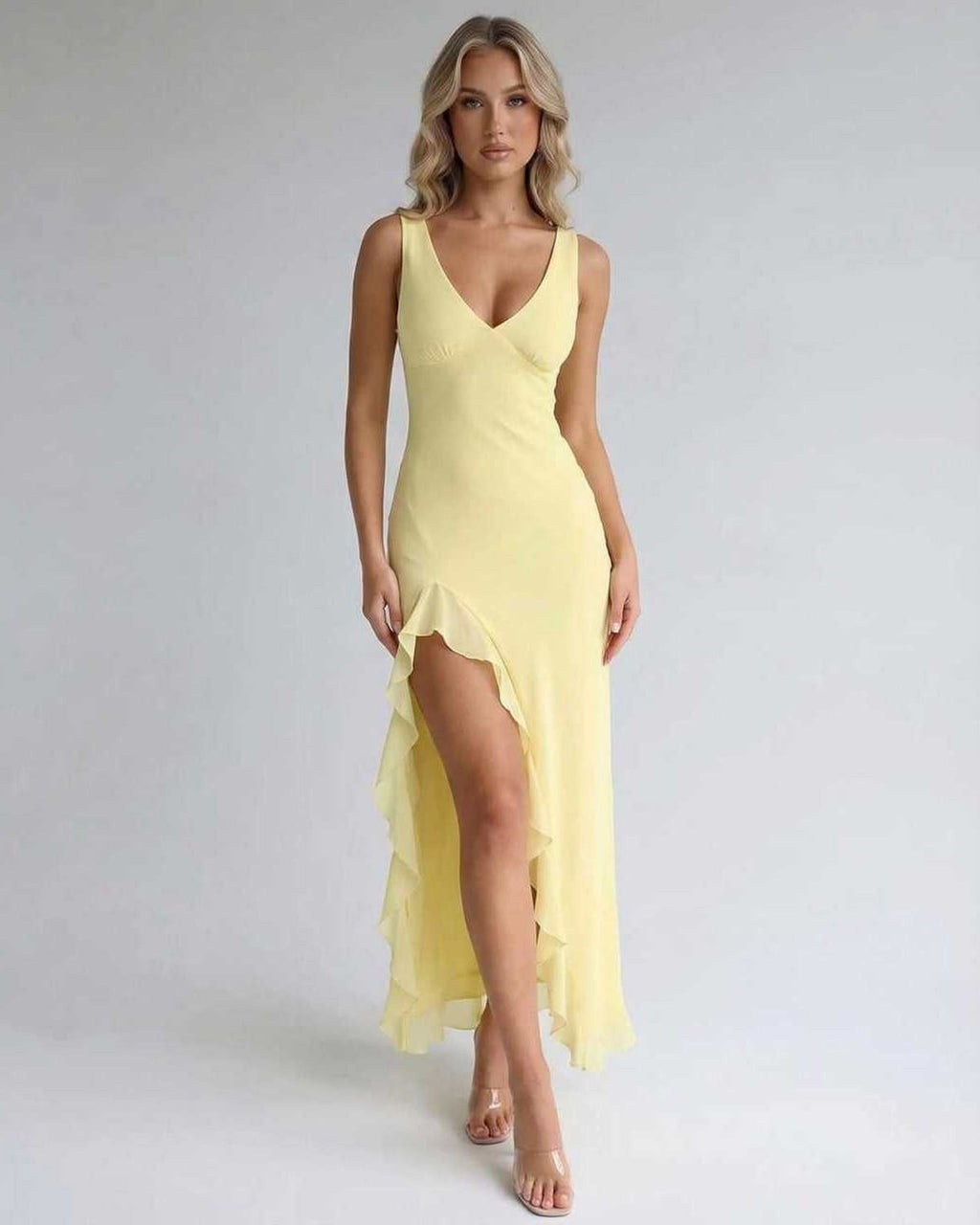 Solara Maxi Dress – Yellow dress with ruffle slit, flowing silhouette by Lauven for an elegant look.
