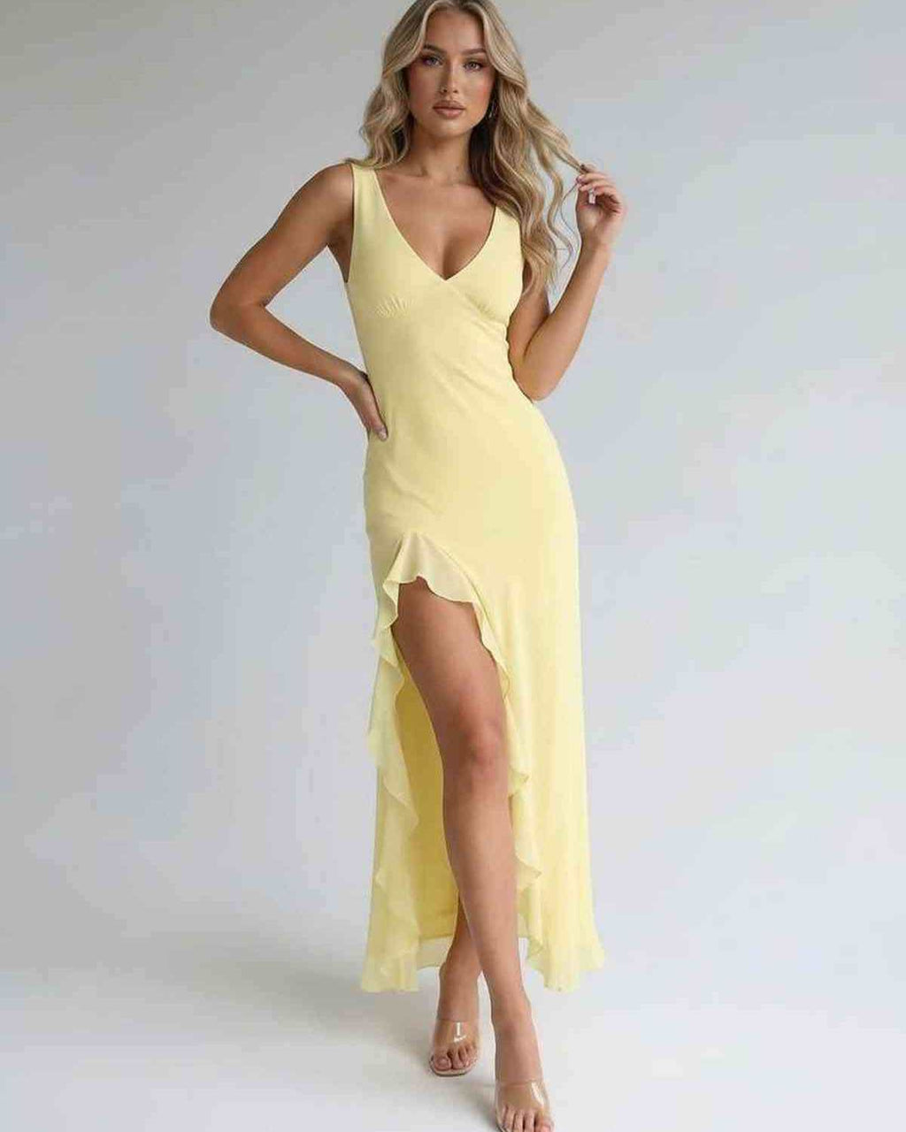 Solara Maxi Dress – Yellow with ruffle slit, elegant flowing silhouette by Lauven, perfect for summer and formal occasions.