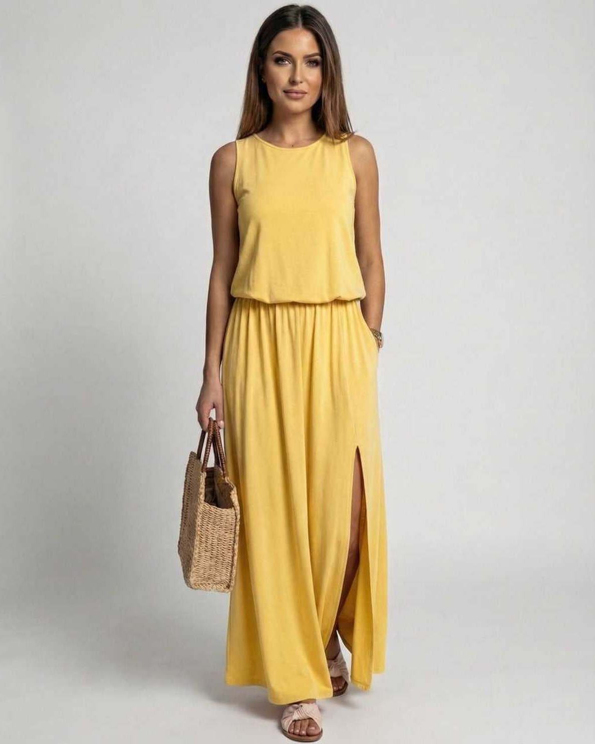 Solara Maxi Dress in vibrant yellow with sleeveless silhouette, side slit, and flowing comfort from Lauven.