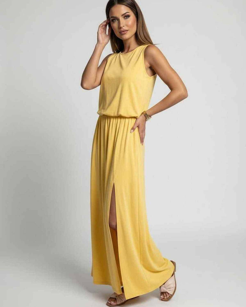 Solara Maxi Dress showcasing vibrant yellow fabric, sleeveless design, side slit, by Lauven for stylish comfort.