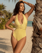 Solara One-Piece Swimsuit by Lauven in yellow, featuring ribbed texture and a halter neckline, perfect for beach and resort lounging.