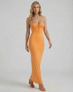 Model wearing the Lauven Soleil Maxi Dress in vibrant orange, featuring spaghetti straps and lace trim.