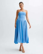 Soleil Midi Dress - Light blue strapless midi dress with pleated skirt by Lauven, offering a modern, feminine silhouette.