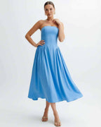 Soleil Midi Dress by Lauven, a strapless light blue cocktail dress with pleated skirt and modern feminine silhouette.