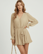 Soleil Mini Dress by Lauven in warm beige pleated chiffon with a flattering V-neckline and elegant silhouette.
