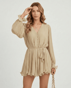 Soleil Mini Dress by Lauven in warm beige pleated chiffon with a flattering V-neckline and elegant silhouette.