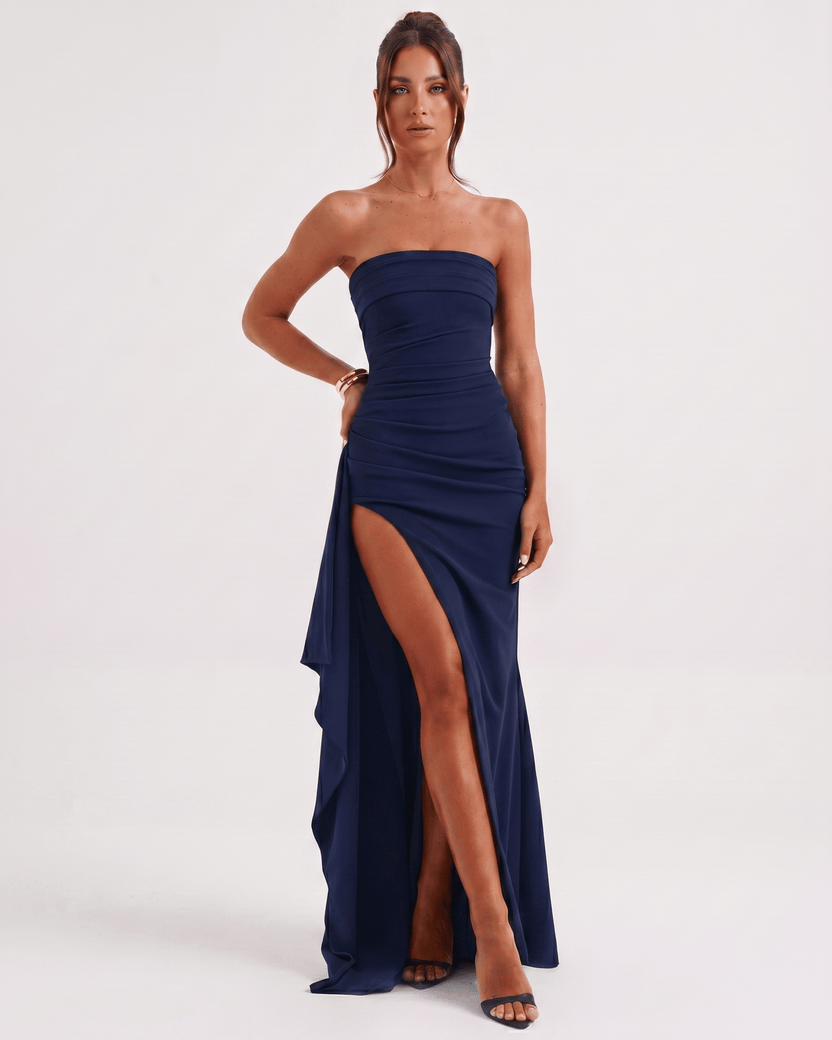 Solenne Maxi Dress in navy with bandeau style, high waist, side slit, and asymmetrical panel for a modern look by Lauven.