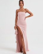 Solenne Maxi Dress in soft pink, featuring a bandeau design, dramatic side slit, and sculpted silhouette from Lauven.