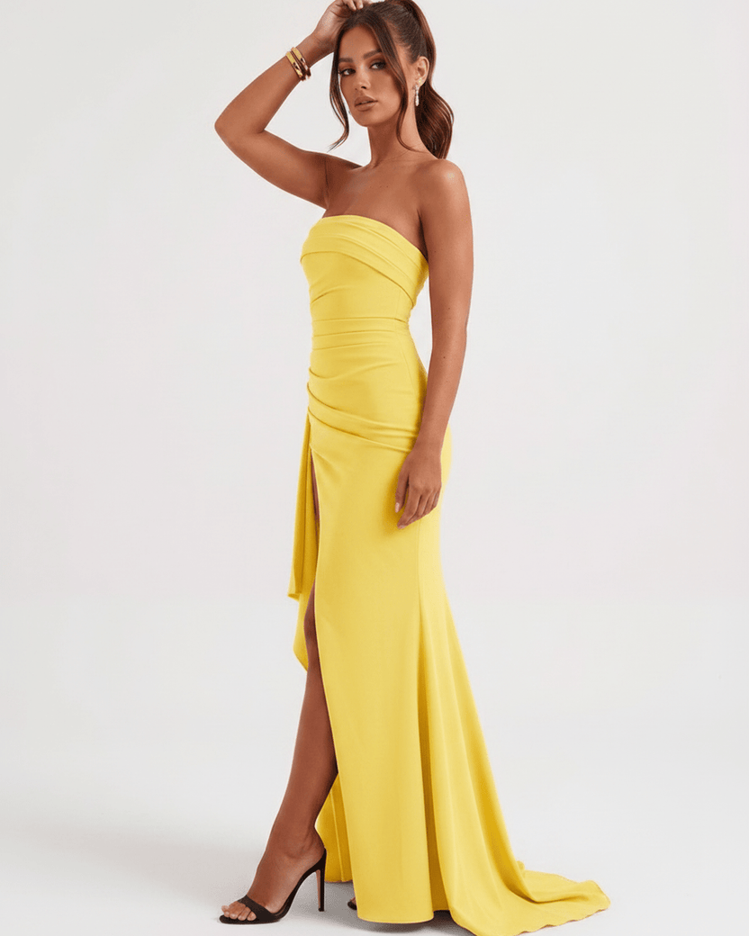 Solenne Maxi Dress by Lauven, yellow strapless dress with side slit, smooth polyester, modern aesthetic.
