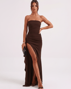 Solenne Maxi Dress in brown, strapless design with high waist, side slit, and flowy silhouette by Lauven.