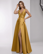 Solenne Maxi Dress - Luxurious satin A-line dress with wrap slit, bow detail, in rich golden hue by Lauven.