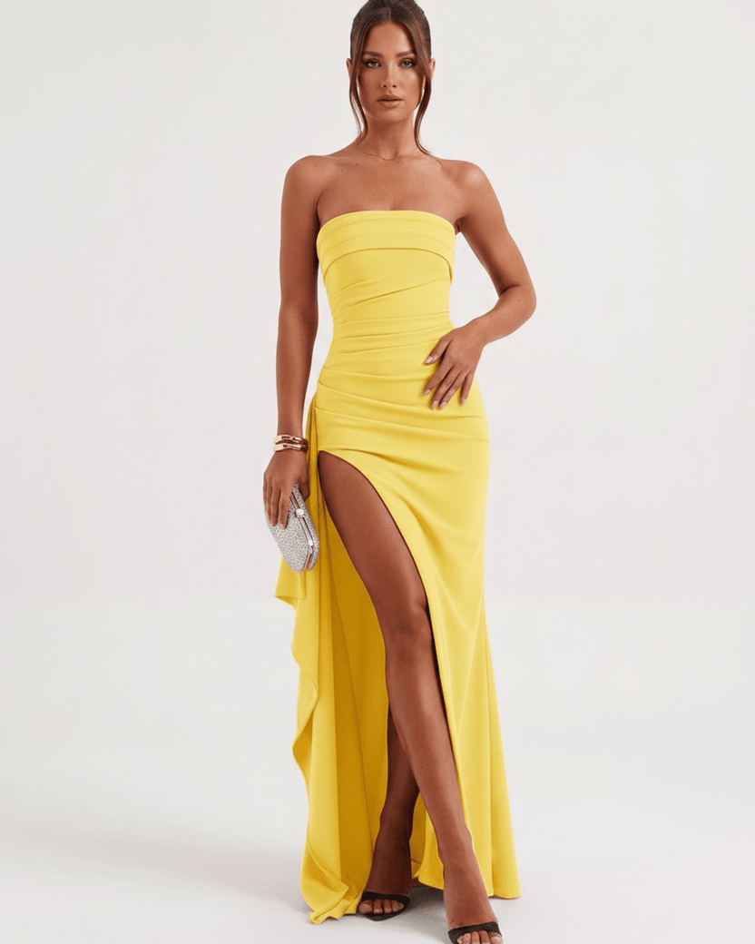 Solenne Maxi Dress in yellow, strapless bandeau with high waist, dramatic side slit and cascading panel by Lauven.