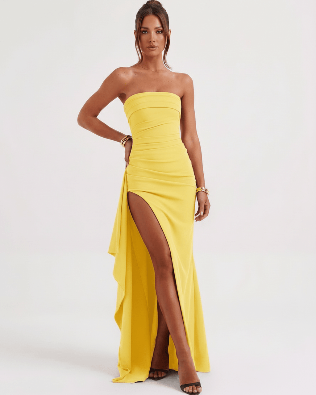 Solenne Maxi Dress by Lauven, strapless yellow design with a dramatic side slit and flowing fabric, perfect for elegant occasions.