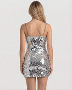 Sterling Mini Dress back view, silver sequin bodycon style by Lauven, showcasing chain straps and light-catching design.