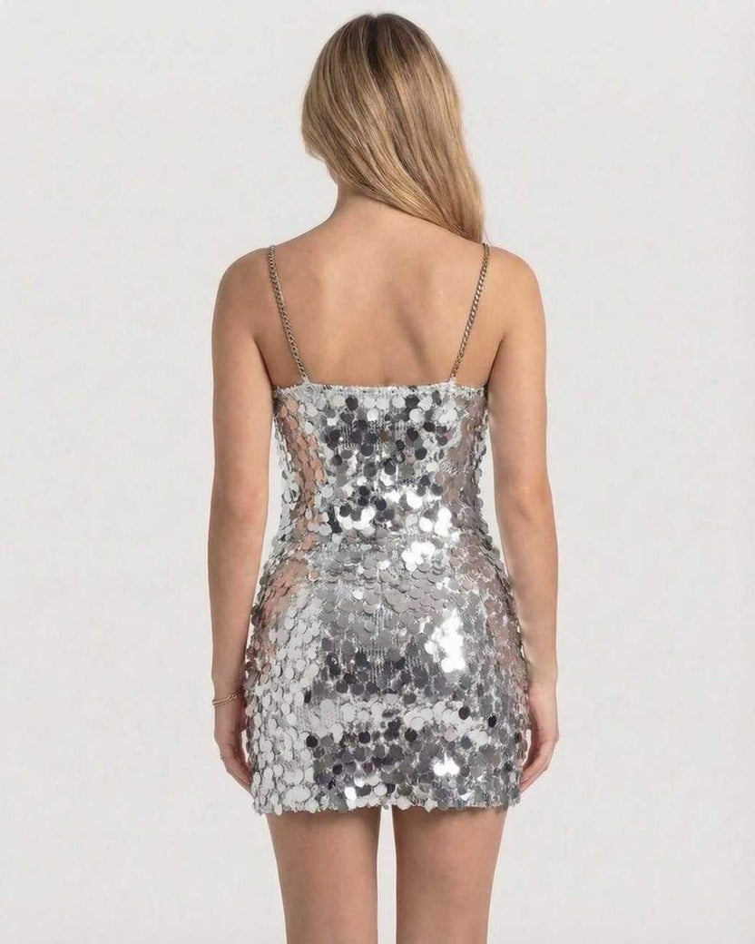 Sterling Mini Dress back view, silver sequin bodycon style by Lauven, showcasing chain straps and light-catching design.