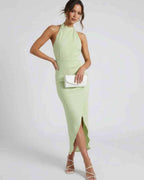 Sylva Midi Dress by Lauven, featuring a unique split pleated neckline and slim maxi silhouette in light green.