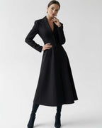 Valen Midi Dress showcasing a structured black A-line silhouette, perfect for modern sophistication by Lauven.