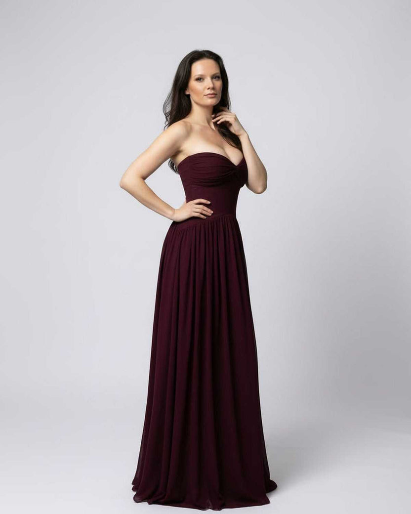 Valencia Maxi Dress - Burgundy strapless elegant flowing formal dress by Lauven, showcasing a graceful silhouette.