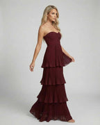 Elegant Valencia Maxi Dress by Lauven in burgundy with strapless design and pleated chiffon tiered silhouette.