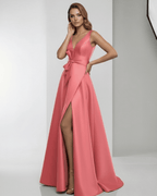 Valencia Maxi Dress featuring a coral satin finish, deep V-neck, A-line silhouette, and elegant floor-length design by Lauven.